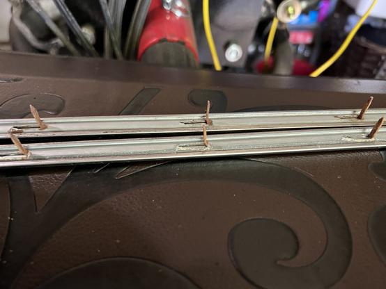 The tabs on the back of Corvair door trim