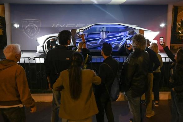 People taking photo of the Peugeot Inception show car in Cannes.