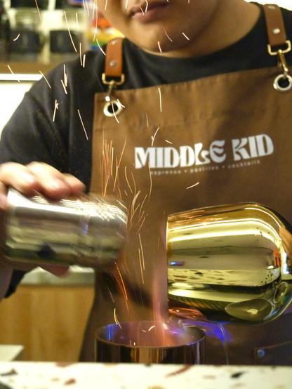 <p>Tucked along GSIS Road in Molino 3, Bacoor, Cavite, a café is turning heads and warming hearts–not just with its brews, but with its brave message. Middle Kid Café, a Bauhaus-inspired space, is open daily from 9 AM to 2 AM, offering more than just caffeine. It&#8217;s a safe space for the LGBTQ+ community and its allies, built on passion, advocacy, and lived experience.</p>



<p>At first glance, some might think it’s just another artsy café where aesthetics take the spotlight over coffee. But Middle Kid Café is different–it has a story to tell and a mission to uphold.</p>



<p>Founded by Dan Salmero, an openly gay man, the café was born from a deeply personal place. <em>“Growing up, I never had a place where I think people can accept me kasi kahit sa bahay noong bata pa ako, hindi ko ma-express yung pagiging bakla ko kasi I really thought being gay is extremely bad kasi kahit saan ako magpunta, there’s someone who’ll judge me and discriminate me. Literal nga na theme-song ko ang Sirena ni Gloc-9.”</em></p>



<p>Now, Dan is rewriting that story one espresso at a time.</p>


<div class="wp-block-image">
<figure class="aligncenter size-large"><img alt="" class="wp-image-2996897" height="1024" src="https://www.rappler.com/tachyon/2025/05/IMG_7168-1-1-scaled.jpg?fit=1024%2C1024" width="769" /></figure></div>


<p>Outside, a large rainbow flag proudly waves, signaling the café’s support and inclusion. Inside, the vibe is welcoming and unapologetically queer.</p>



<p>Their b