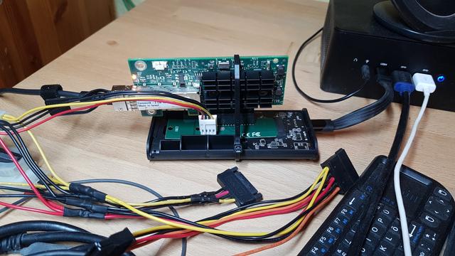 A Mellanox ConnectX-3 10G NIC, on an M.2 to PCIe x4 adaptor board, in an SSD enclosure, connected via USB4 (it's an AMD mini, so we're not calling it Thunderbolt). Externally supplied 12V makes it go brrr.