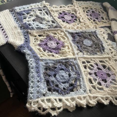 Photo of a grandma square cardigan in white, blue, and purple