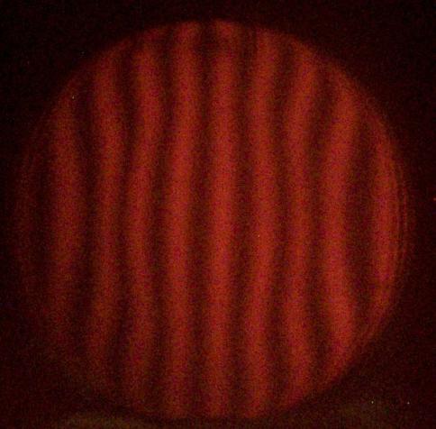 Mirror after 30 mins of high pressure 1/3 diameter center over center strokes. The central depression is still there, but now the lines outside it bend outwards. The edge is worn down! Oh no!