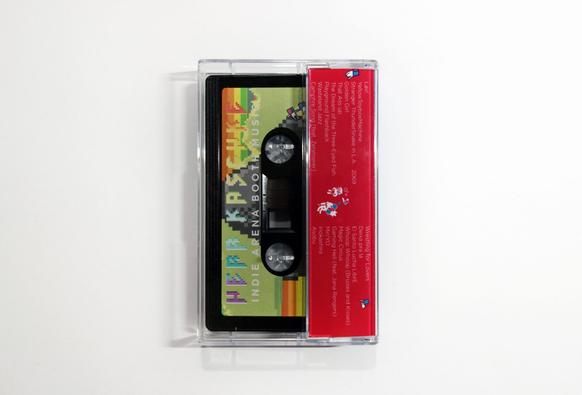 You see the Tape included in the JCard from the back. The red backside includes the Tracklist