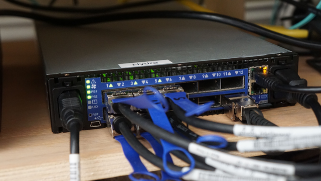 A picture of the Mellanox SX6012 12-port 40 GbE switch with half of the ports online.