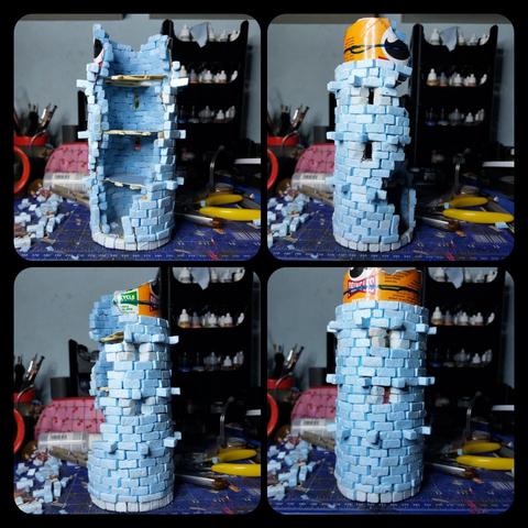 Ruined tower made of tiny XPS foam bricks along. Three of four floors have been walled up and only a small crest of pringle can is still visible.