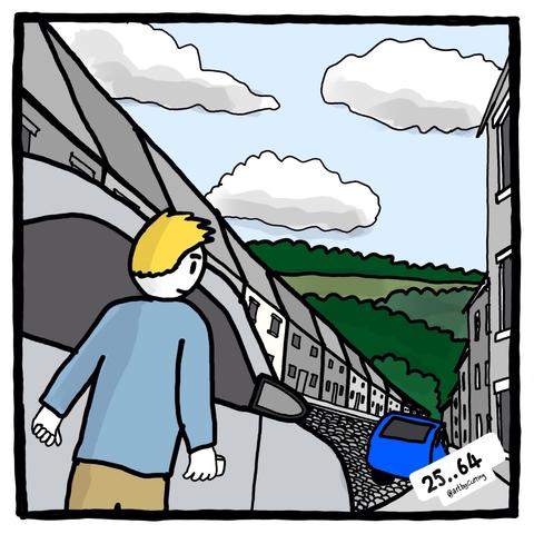 Pictured about to get into car on a steep road down to the river (not seen) with terraced houses either side and a blue clouded sky.