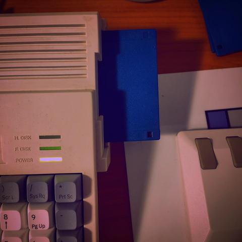 One of the floppies is inserted into an Amiga 1200