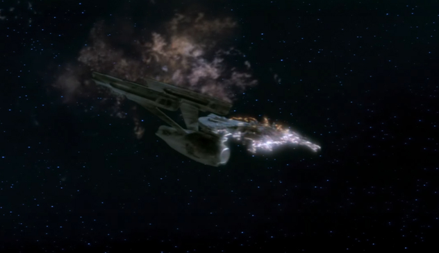 Star Trek's Enterprise NCC-1701 on fire (in space). 

The saucer was destroyed first. The ship's self-destruct destroyed the Enterprise saucer section and sent it careening into the atmosphere below.