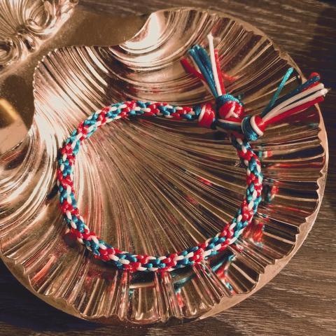 A kumihimo (Japanese braiding) bracelet in trans flag colors.