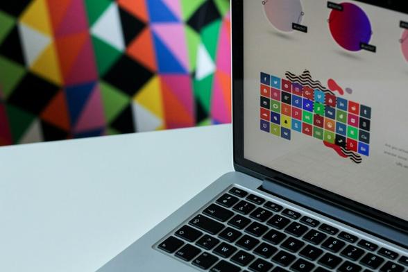 silver laptop computer with assorted logo screengrab - How to Optimize Your WordPress Theme (Free or Paid) for Speed, SEO, and User Experience - Mania Developers