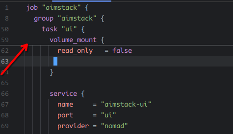 Screenshot of a text editor. A red arrow in the screenshot points to a header block which has just the "job", "group", "task" and "volume_mount" lines visible. The current line being edited and rest of the document is rendered normally.