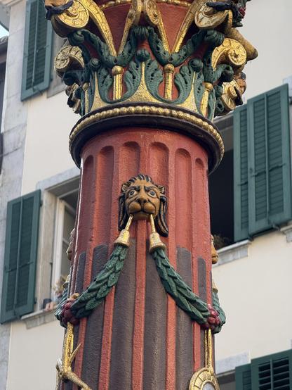 There's a small lion attached to the column on which Justice stands. The lion looks like a drawing in a comic book. Actually, the whole statue looks that way. It is very colorful and typical of the time around 1400, when it was built. But this one is a replacement which was errected in the year 1545.