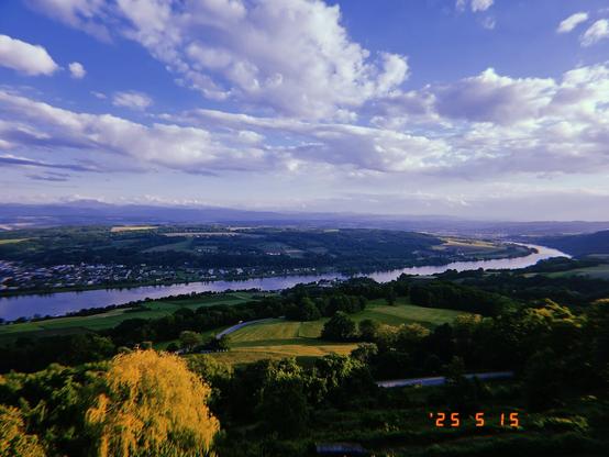 Hilly and lush green landscape with river Danube in the middle.