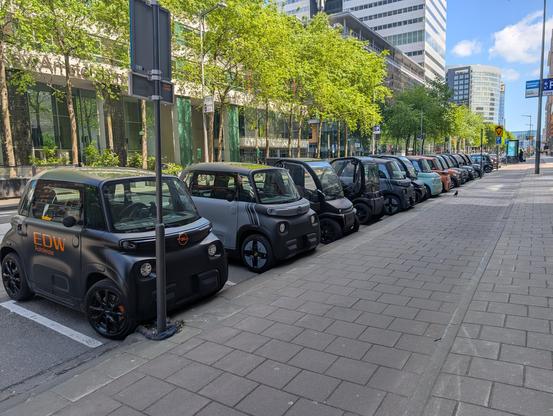 A line of microcars parked at Zuidas in Amsterdam