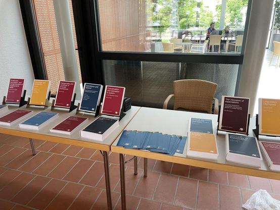 A table with books from Language Science Press