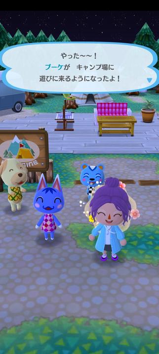 Screenshot of a purple-haired person beside Rosie the blue cat wearing a pink plaid dress. They are both smiling happily, while Ricky the blue squirrel and Goldie the golden retriever applaud in the background. Japanese text reading "Yay~! Rosie came to hang out at the campsite!"