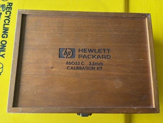 Photo of a wooden case originally used for a HP85033C calibration kit. Now available for general lab use (adapters & cables).