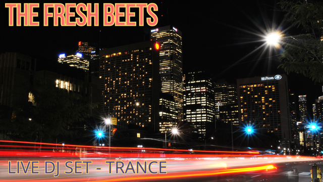 Dark night over a bustling city, skyscrapers lighting up the distance.

The top left corner is titled "The Fresh Beets" and the bottom left corner is subtitled "Live DJ Set - Trance."