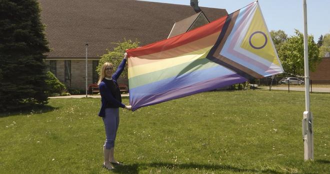 Our minister raising the flag to celebrate International Day Against Homophobia, Biphobia and Transphobia in front of our church #idahobit #LGBTQ2S+