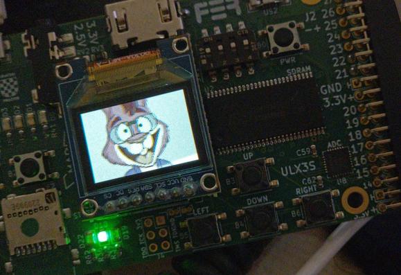 Circuit board labeled ULX3S showing a cartoon rabbit on a small OLED display.