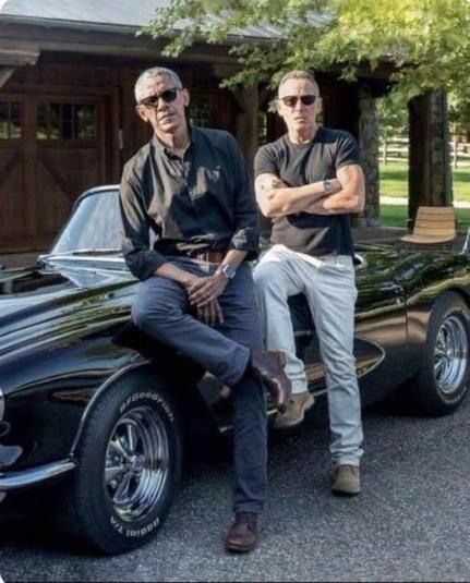 Obama and the Boss sitting on a really cool car that I couldn't afford if it were made out of dryer lint. Two guys who are the definition of cool and talented. The exact opposite of Fat Hitler.