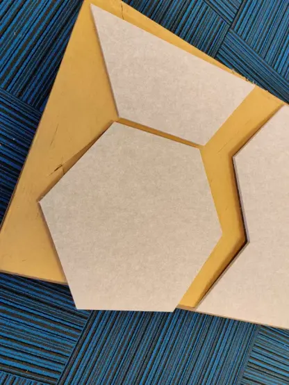 The grey felt fish shape from the previous post has been cut in to one hexagon and one half-hexagon.