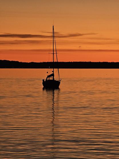 sailboat at sunset, orange sky