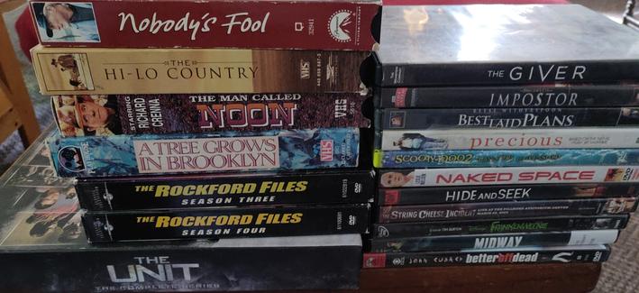 4 VHS movies, 10 movies on DVD, one concert film, two seasons of Rockford Files, and the complete The Unit set on DVD.