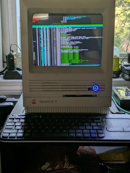 MAC SE/30 gutted with a Odroid and 10" LCD installed instead. Screen shown running htop. Screen is just a tiny bit too large for the Mac shell, so the edges are missing.