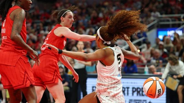 Angel Reese held back by referee after Caitlin Clark draws flagrant foul for shove in fiery Fever-Sky contest