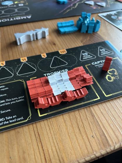 An arcs player board with 11 ships taken as trophies