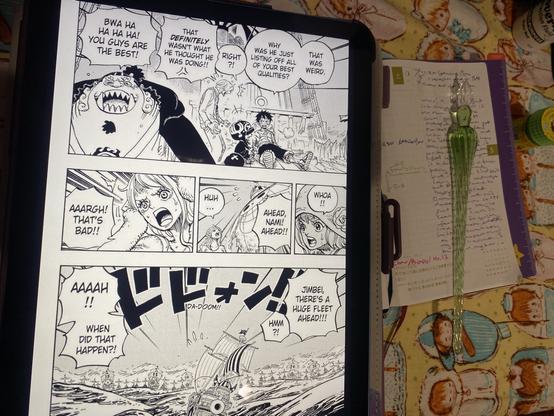 One Piece hobonichi open to the 5/17 page underneath an iPad displaying manga