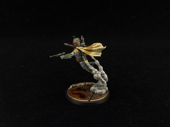 Boba Fett from the side, showing armor/helmet details and cape, as well as jetpack smoke trails.