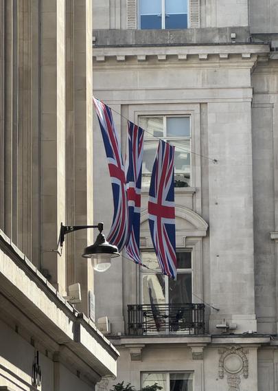 Union flags flying on Regent Street caught on angle from cross street