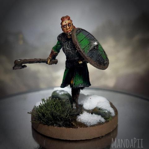 Barbarian warrior, looks viking or old English (misguidedly named 'Anglo Saxon' as there were so many more groups there) ginger dude running axe in hand with round shield in snow.