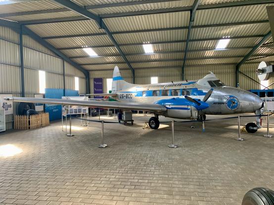 Old DeHavilland aircraft in hangar