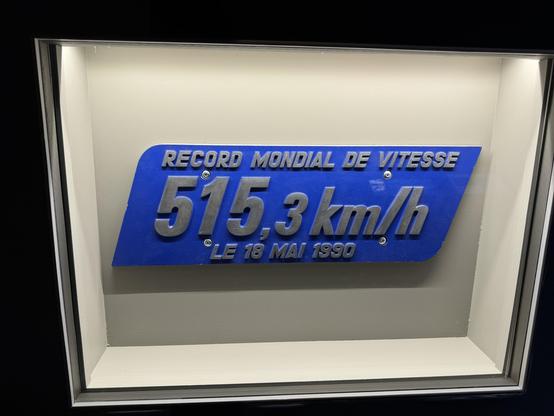 A metal plaque that was attached to the carriages of unit 325 commemorating the speed record of 515.3 km/h