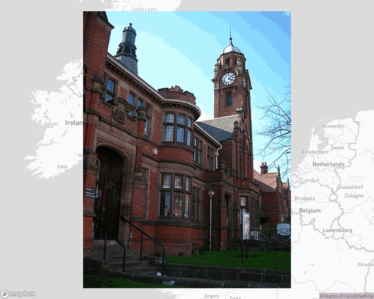 A photo of or from a library from the linked website, overlaid on a cropped world map where it's located.