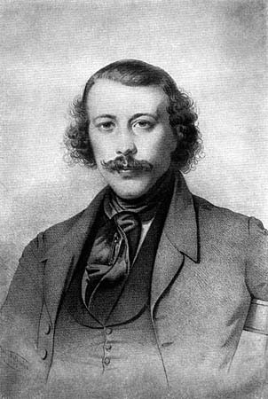 Bakunin schaut geradeaus auf die betrachtende Person, mit leicht ergrautem, struppigem Haar und Bart. Ein Portrait des jungen Michail Bakunin. Das Portrait ist aus dem Jahre 1843 und von H. Mitreuter gezeichnet.