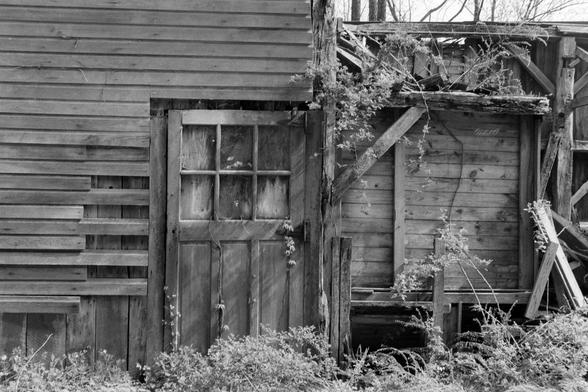The side door of an abandoned barn