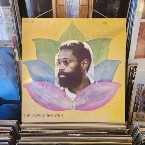 Album cover features a photograph of Bennie Maupin's head, placed in the middle of a colorful illustration of a lotus flower.