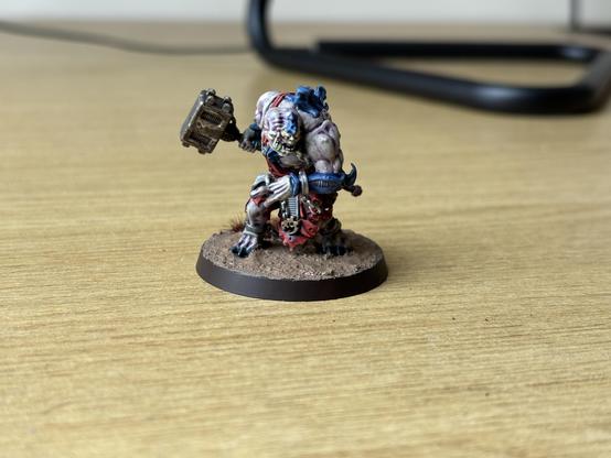 Genestealer Cults Abominant miniature painted with red robes and blue chitin.