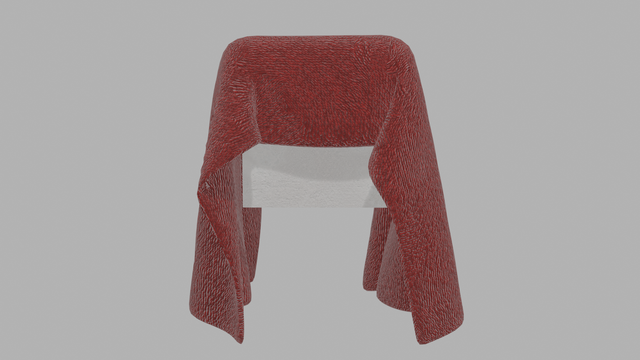 Toalla de terciopelo sobre cubo de yeso.