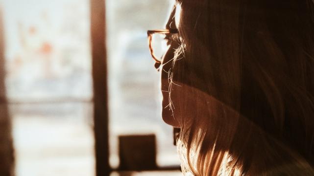 Woman waiting near a window