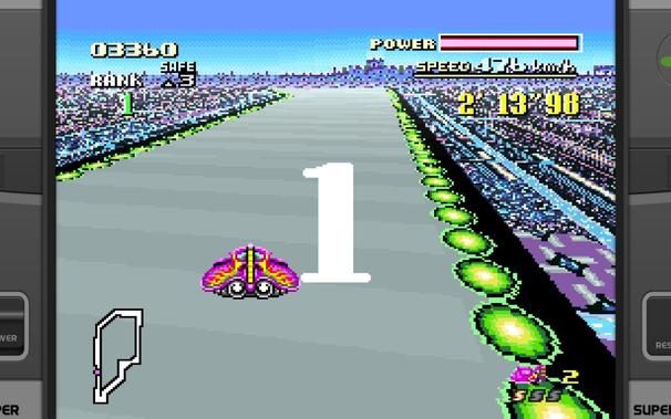 A futuristic racing game screenshot showing a vehicle moving at high speed on an elevated track. The car has a distinctive design with red and yellow colors, indicating the players character. The environment suggests a cityscape under a dark sky with neon lights, possibly representing future technology or urban decay. There is a timer displaying 01:38 at the top, suggesting that the game session is timed. At the bottom of the screen, there is an indicator showing the vehicles speed at SPEED 175 MPH. The perspective is first-person, simulating the experience of driving a high-speed race.