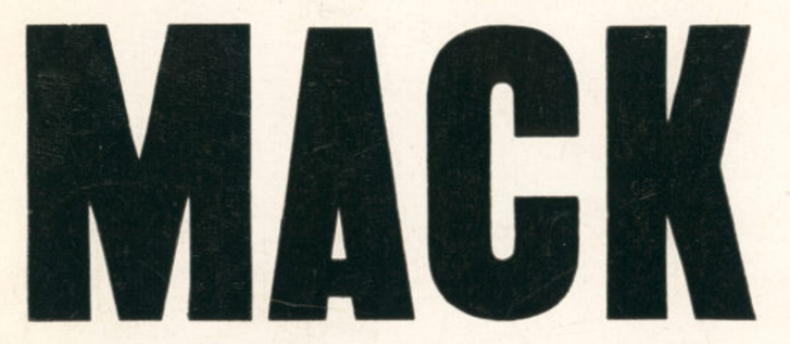 “MACK” writ large. Black on white. Sans-serif letters.