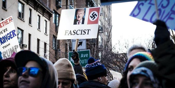 New York City protest against President Trump's cruel immigration policies, calling out Trump as a "Fascist," while other signs say "Love is Love is Love is Love," and "Together We Are Stronger than Trump."