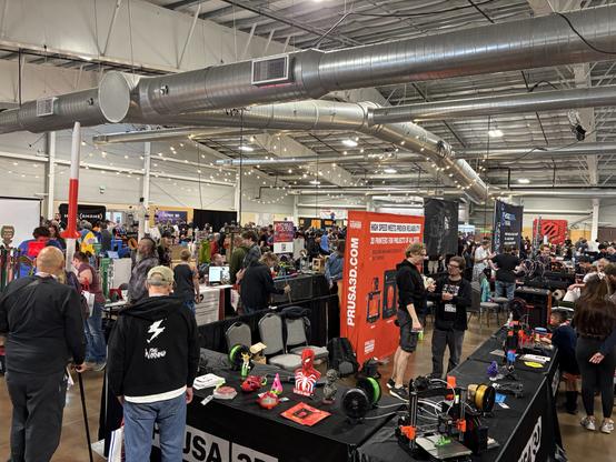An expo hall with all kinds of booths with 3D printers and accessories
