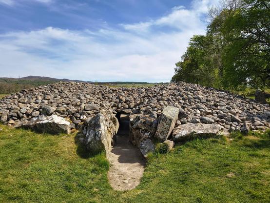 Looking into the entrance of Corrimony Chambered Cairn. The passage is a hands and knees job but worth it as the inside is wonderful and peaceful.