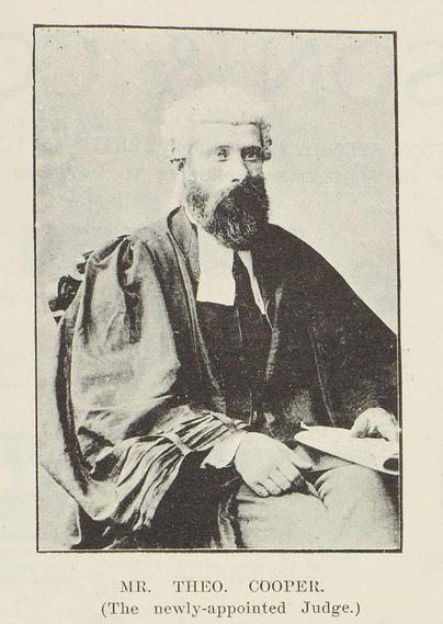 Black-and-white portrait photo: Mr. Theo. Cooper (The newly appointed judge). 1901. Description: A three-quarters seated portrait of Theophilus Cooper in legal attire, including a wig. He is heavily bearded. Citation: The New Zealand Graphic and Ladies Journal, 23 February 1901, p. 363. Auckland Libraries Heritage Collections NZG-19010223-0363-01. https://kura.aucklandlibraries.govt.nz/digital/collection/photos/id/132265